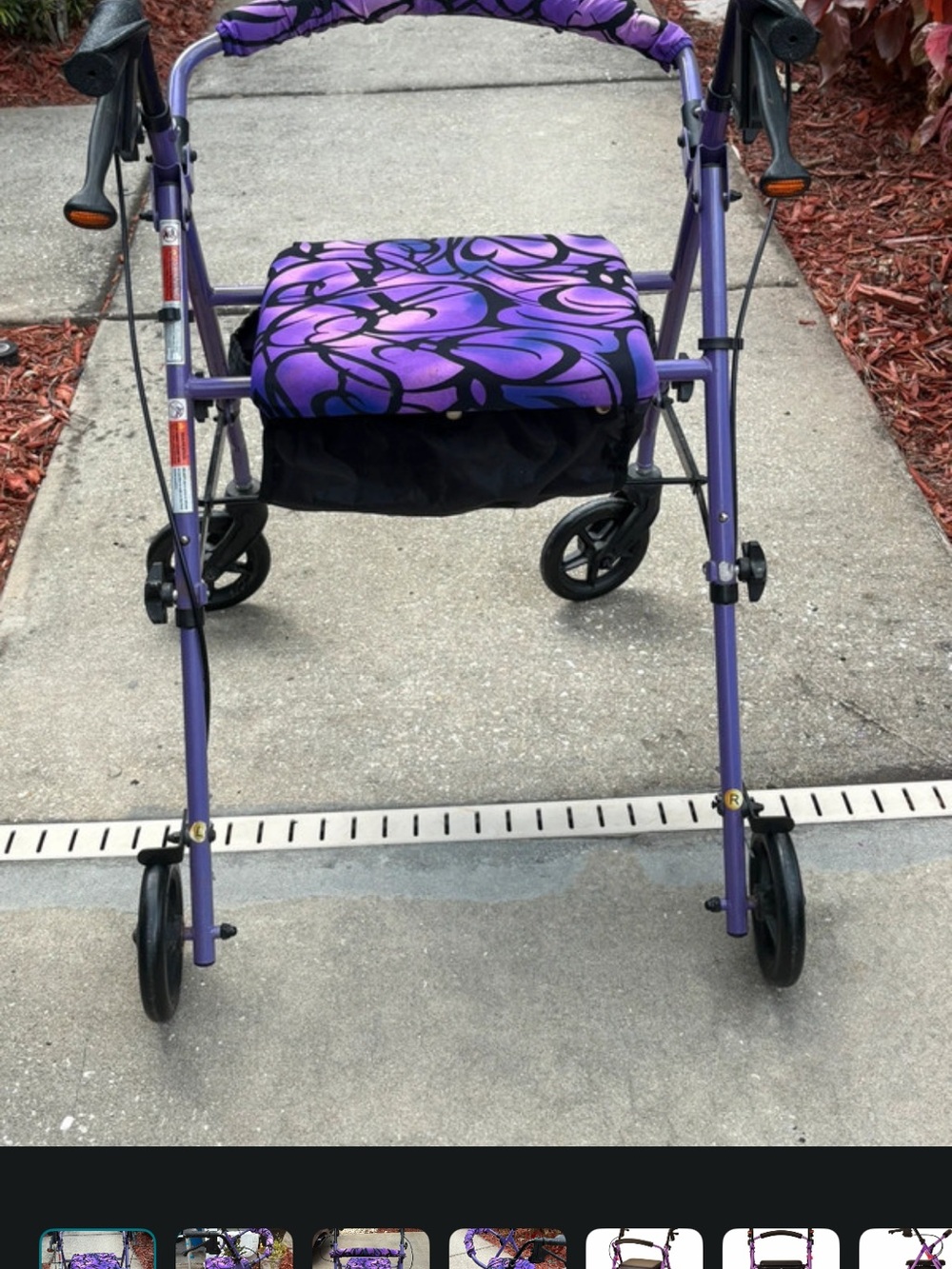 Nova walker with a comfortable seat. Features a vibrant purple frame and black a